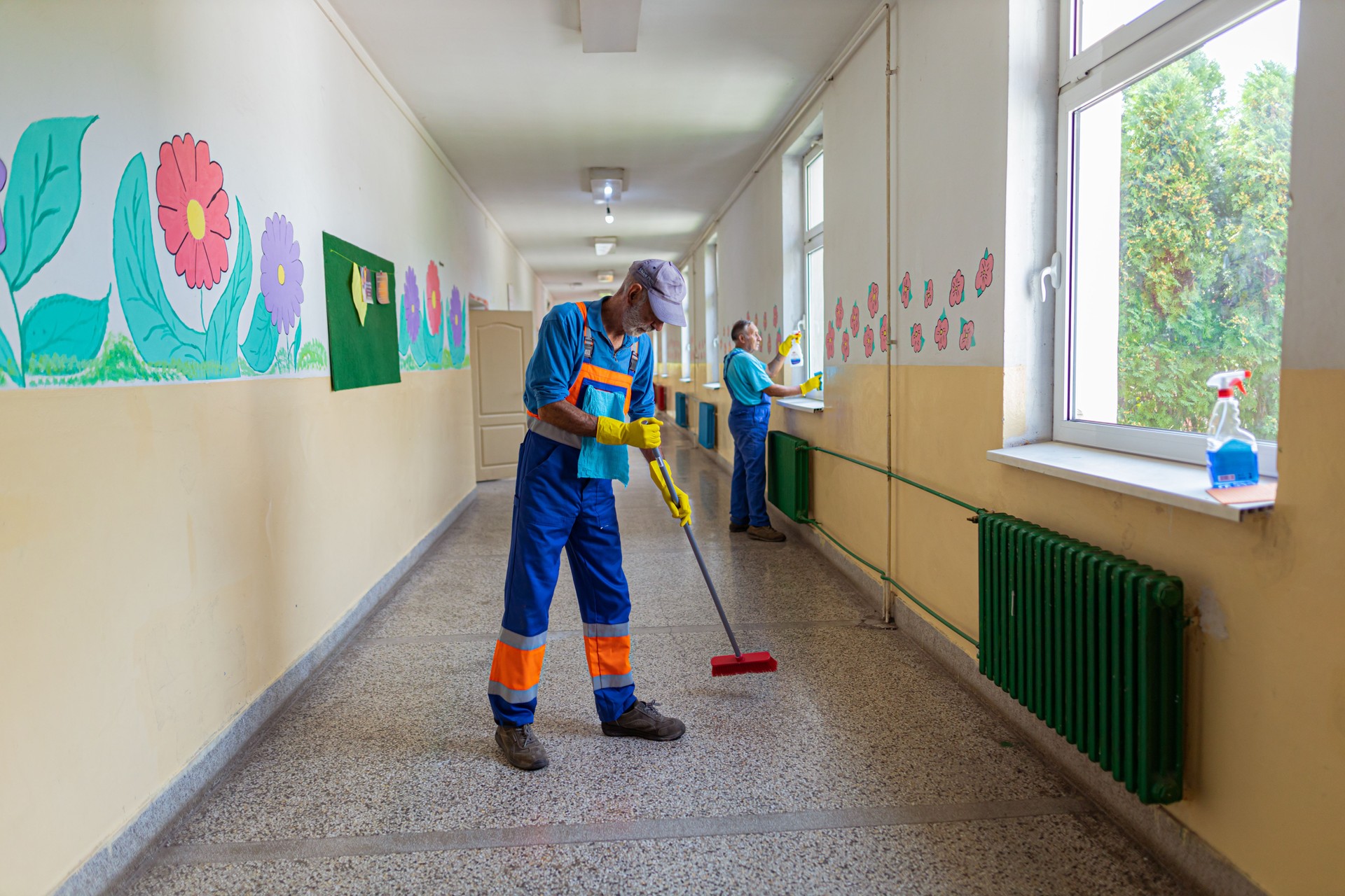 Two janitor colleagues at work